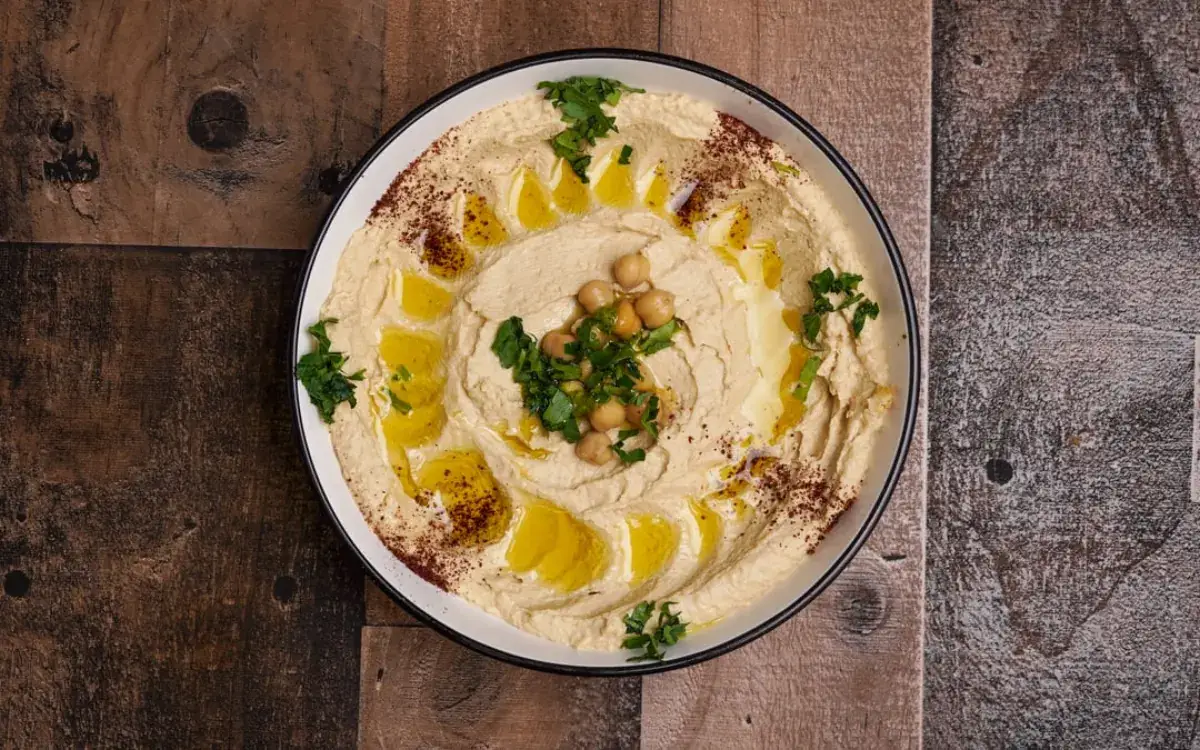 Classic hummus topped with olive oil and whole chickpeas